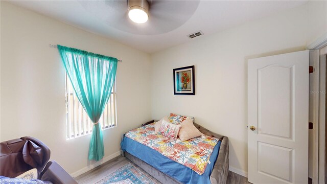 bedroom featuring hardwood / wood-style flooring and ceiling fan