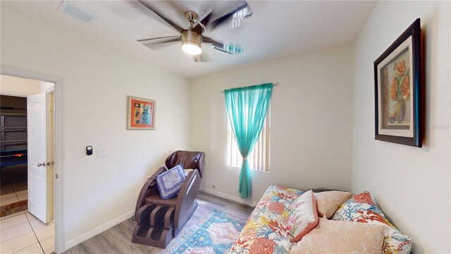 bedroom with ceiling fan and light hardwood / wood-style floors