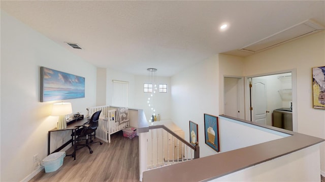 interior space featuring a textured ceiling and light wood-type flooring