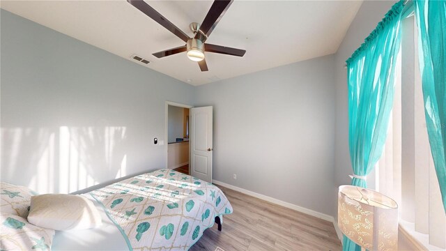 bedroom featuring ceiling fan and light hardwood / wood-style flooring