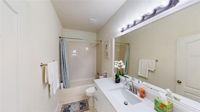 full bathroom with shower / bath combo, tile patterned floors, a textured ceiling, toilet, and vanity