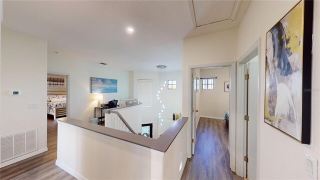 corridor featuring hardwood / wood-style floors