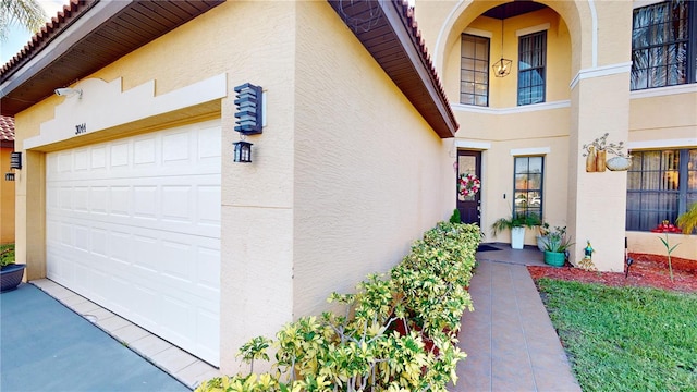 view of exterior entry with a garage