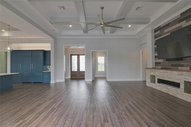 unfurnished living room with beam ceiling, french doors, coffered ceiling, dark hardwood / wood-style flooring, and a fireplace