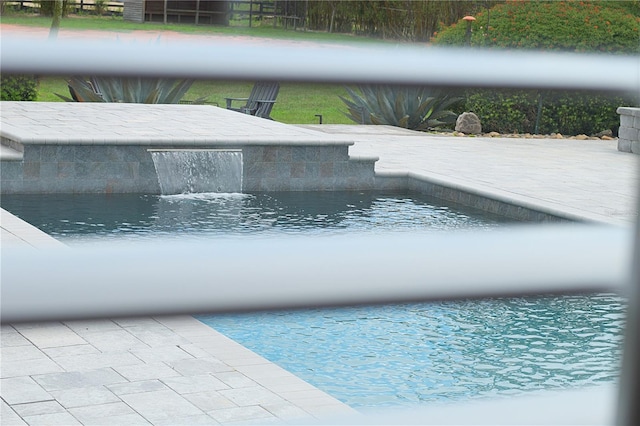 view of pool featuring pool water feature