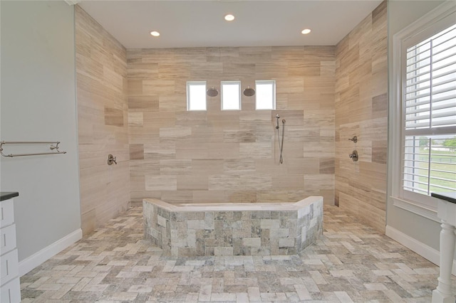 bathroom with tiled shower