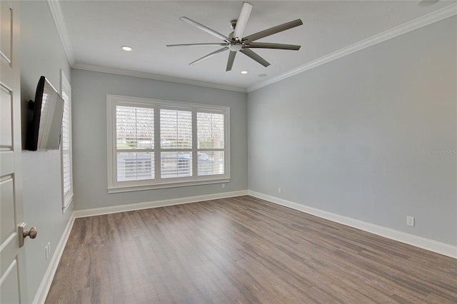 spare room featuring hardwood / wood-style flooring, ceiling fan, and ornamental molding