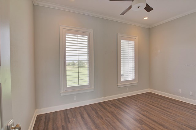 empty room with ceiling fan, dark hardwood / wood-style flooring, and crown molding