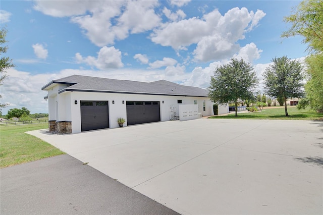 view of home's exterior featuring a yard and a garage