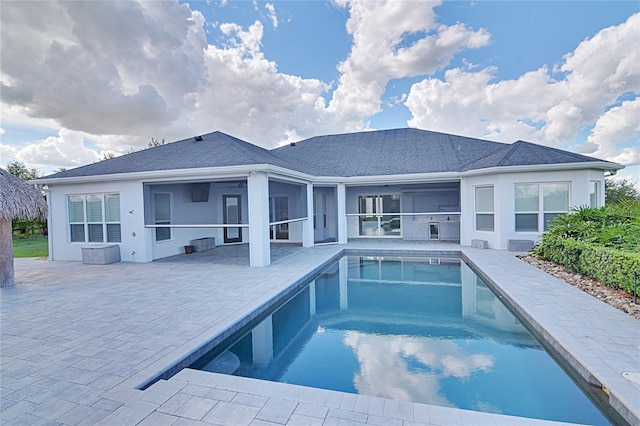 view of pool featuring a patio