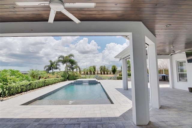 view of pool with a patio and ceiling fan