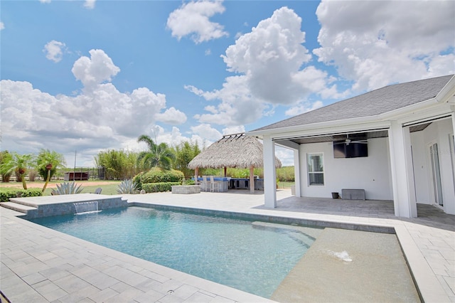 view of pool featuring a gazebo, pool water feature, a bar, and a patio