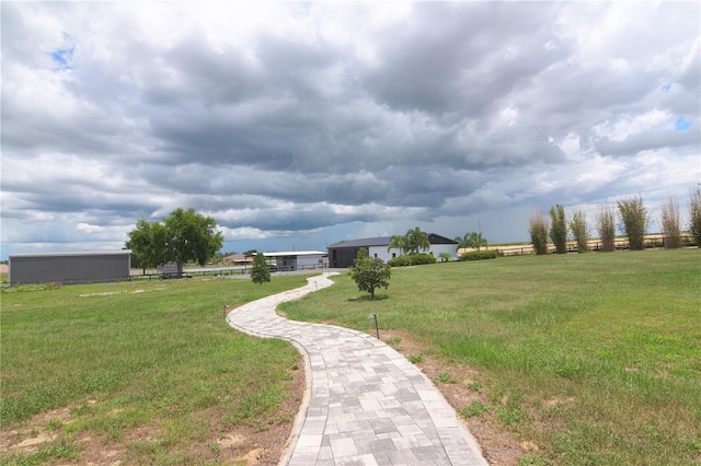 view of property's community featuring a yard