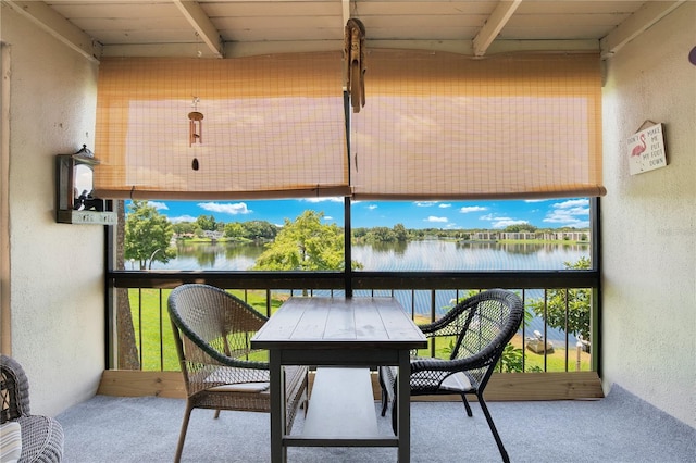 balcony featuring a water view