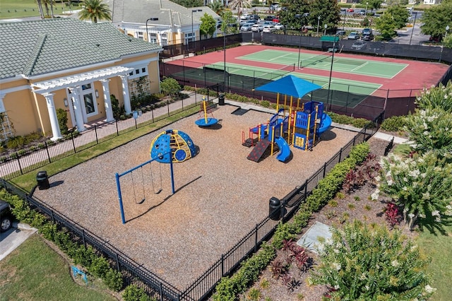 community playground featuring a pergola, a tennis court, and fence