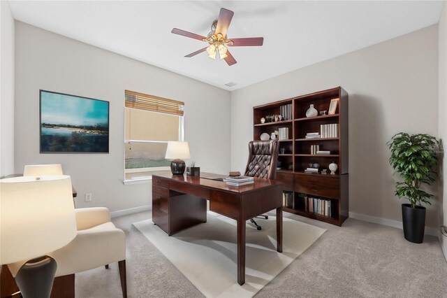 office featuring ceiling fan and light colored carpet