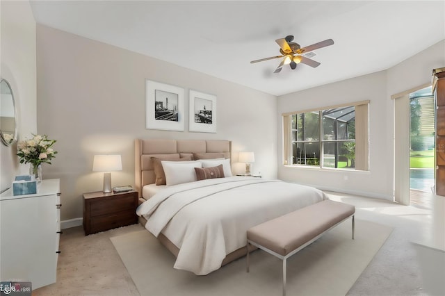 bedroom with light carpet, ceiling fan, and baseboards