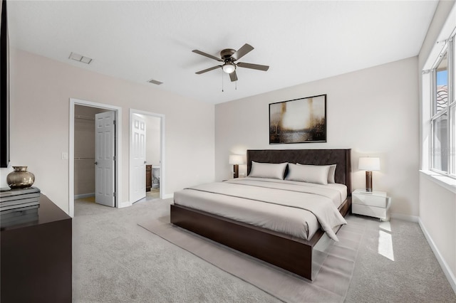 bedroom featuring light carpet, baseboards, visible vents, and ceiling fan