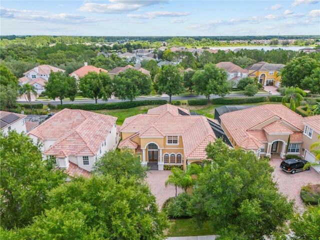 bird's eye view featuring a residential view and a water view