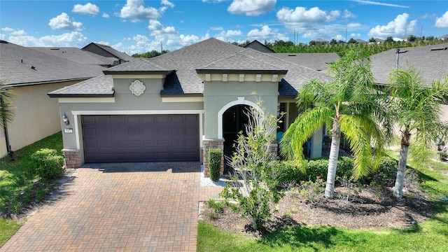 view of front of property with a garage