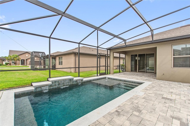 view of swimming pool with pool water feature, glass enclosure, a patio area, and a lawn