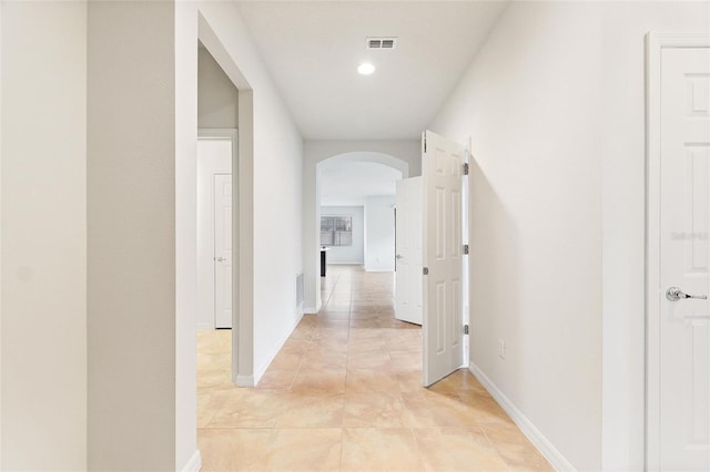 corridor with light tile patterned floors