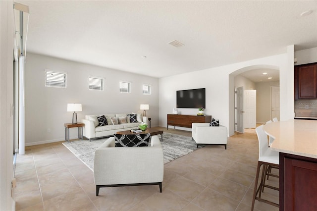 living room featuring light tile patterned flooring