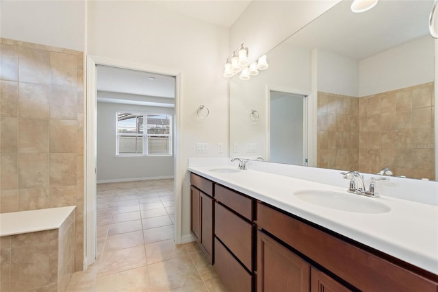 bathroom with tile patterned floors and vanity