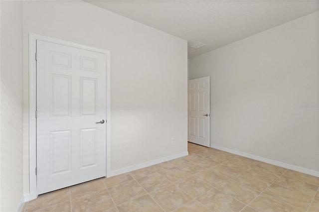 view of tiled spare room