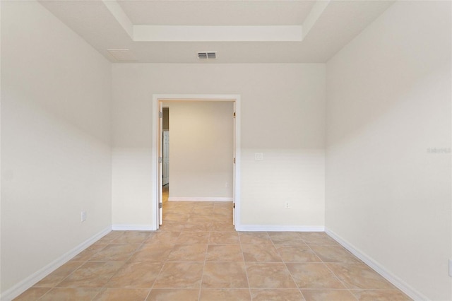 spare room featuring light tile patterned floors