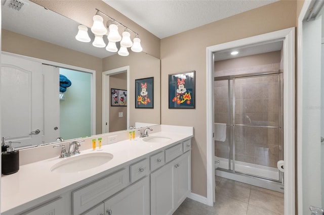 bathroom featuring walk in shower, tile patterned floors, vanity, and toilet