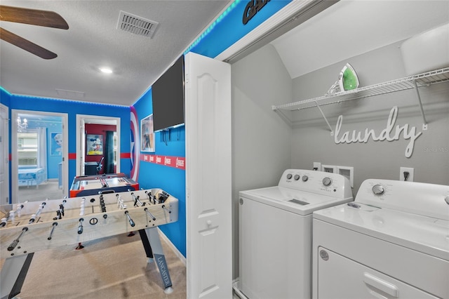 washroom featuring a textured ceiling, ceiling fan, and separate washer and dryer