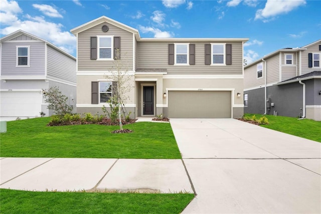 view of front of house with a garage and a front lawn