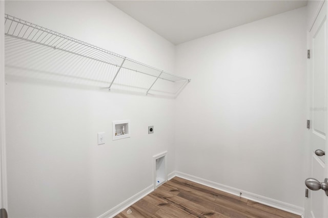 clothes washing area featuring dark wood-type flooring, washer hookup, and electric dryer hookup