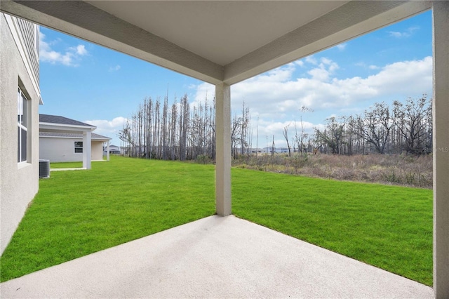 view of yard with cooling unit and a patio area