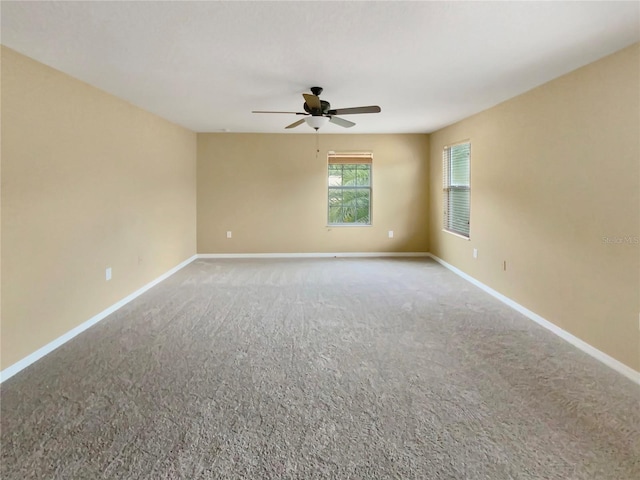 empty room with carpet and ceiling fan