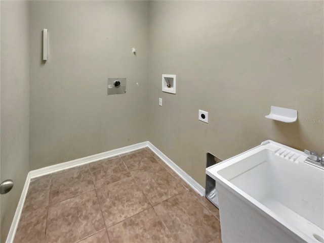 laundry room featuring tile floors, sink, hookup for an electric dryer, and washer hookup