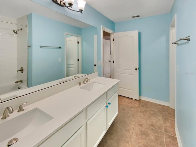 bathroom with tile flooring, shower / washtub combination, and double sink vanity