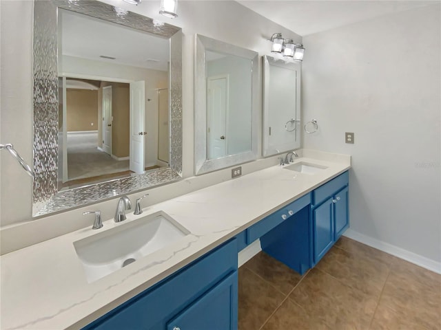 bathroom featuring dual bowl vanity and tile flooring