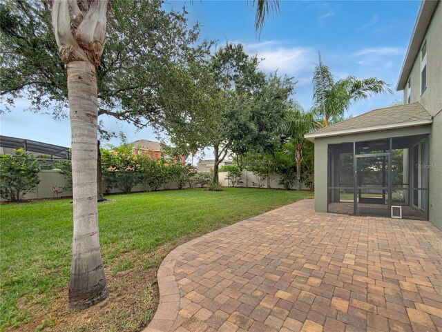 view of patio / terrace with a sunroom