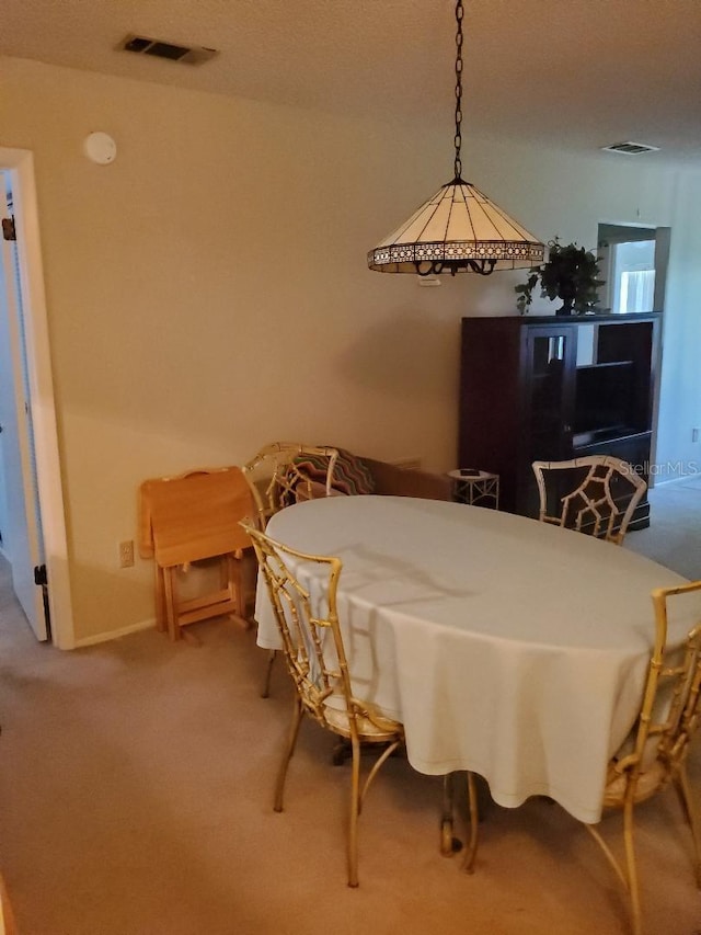 view of carpeted dining space