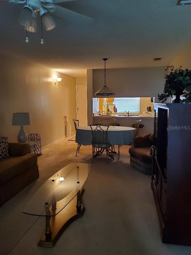 recreation room featuring ceiling fan and carpet flooring