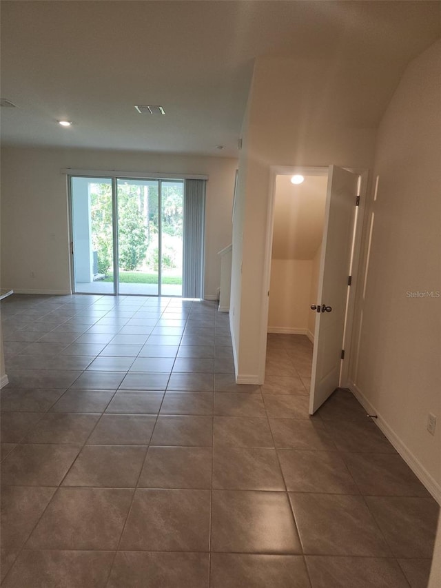 spare room with tile patterned floors