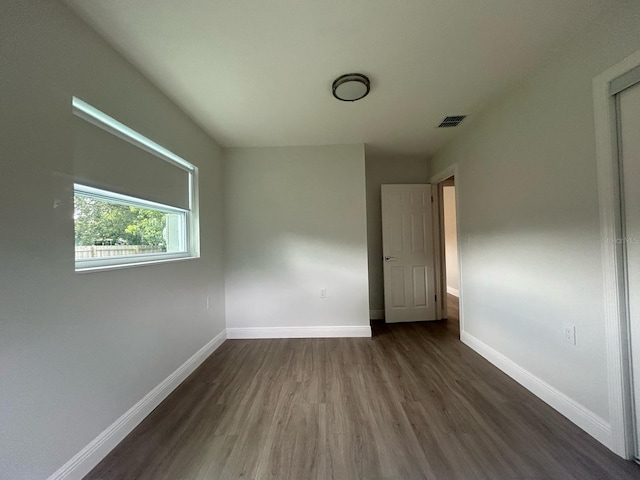 empty room featuring dark hardwood / wood-style floors