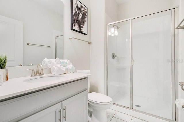 bathroom with vanity, toilet, and an enclosed shower