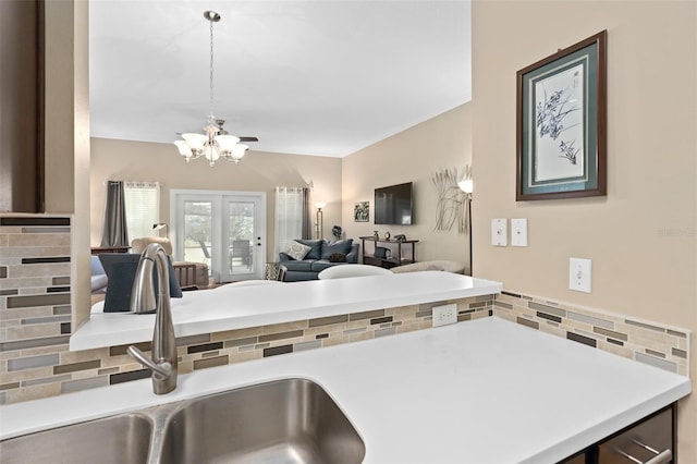 kitchen with a notable chandelier and sink