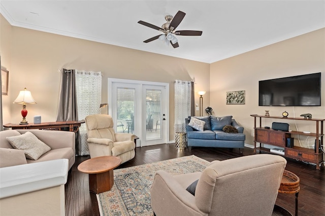 living room with ceiling fan, crown molding, and dark wood-type flooring