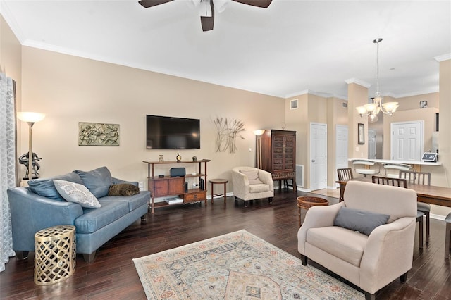 living room featuring ceiling fan with notable chandelier, dark hardwood / wood-style floors, and ornamental molding