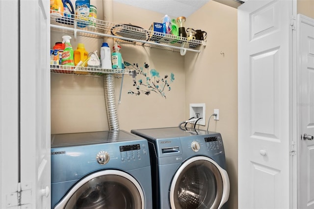 laundry room with washer and clothes dryer