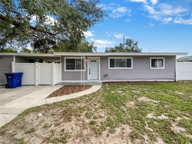 ranch-style house with a front lawn